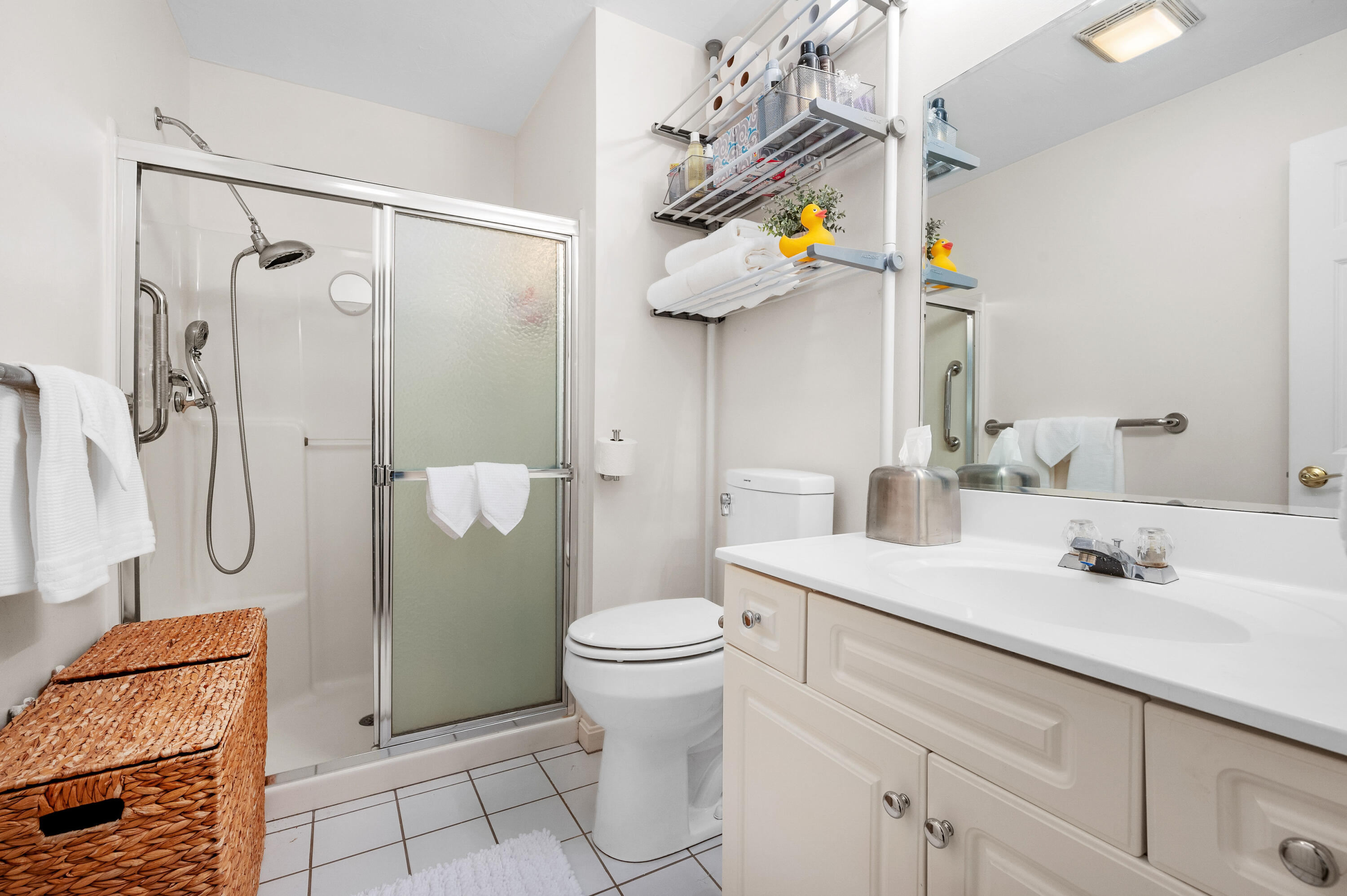 7 Red Cedar Road, Unit 7 Mashpee, MA 02649 - Photo 15 of 37 a bathroom with a sink a toilet and shower