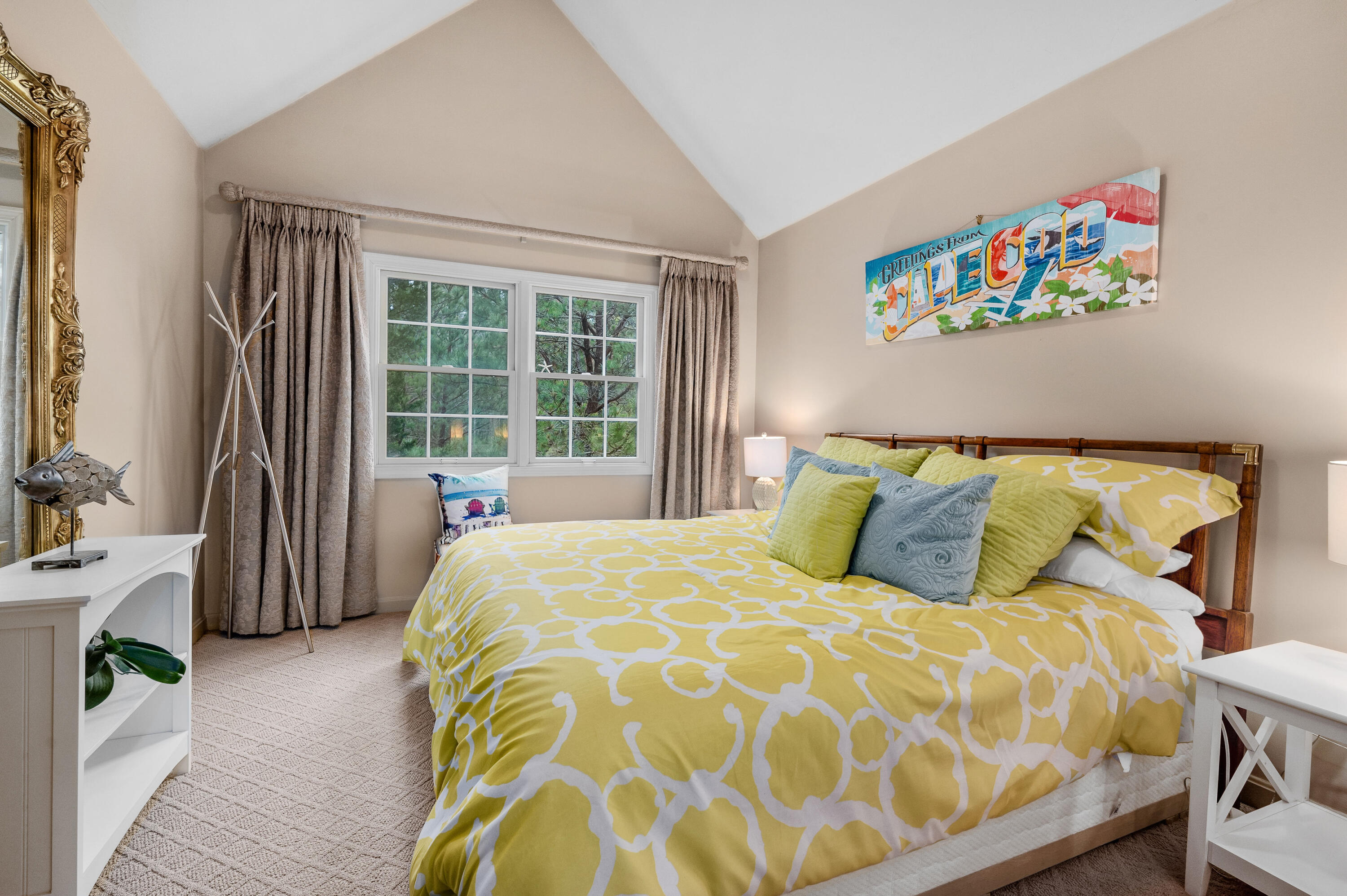 7 Red Cedar Road, Unit 7 Mashpee, MA 02649 - Photo 29 of 37 a bed sitting in a bedroom next to a window