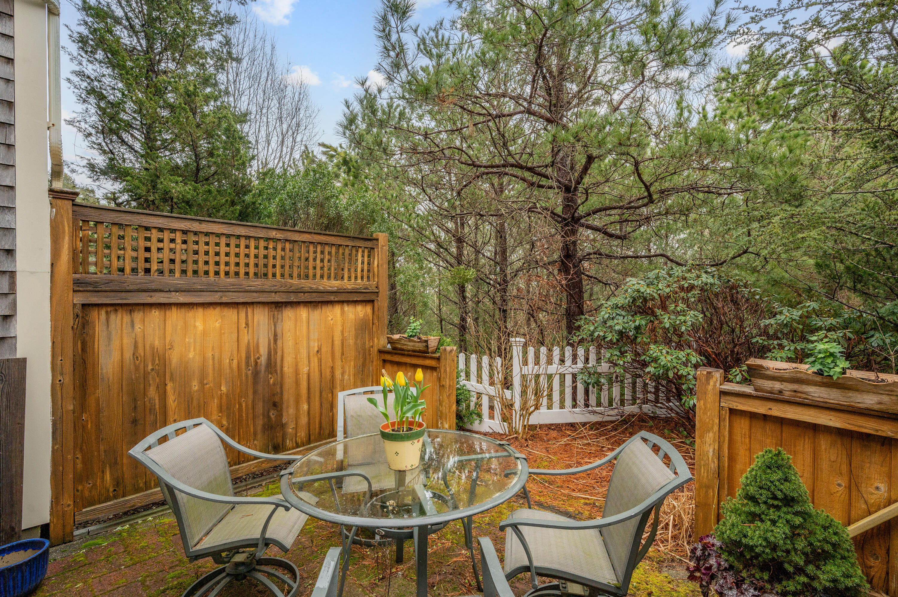 7 Red Cedar Road, Unit 7 Mashpee, MA 02649 - Photo 34 of 37 a view of a chairs and table in the balcony