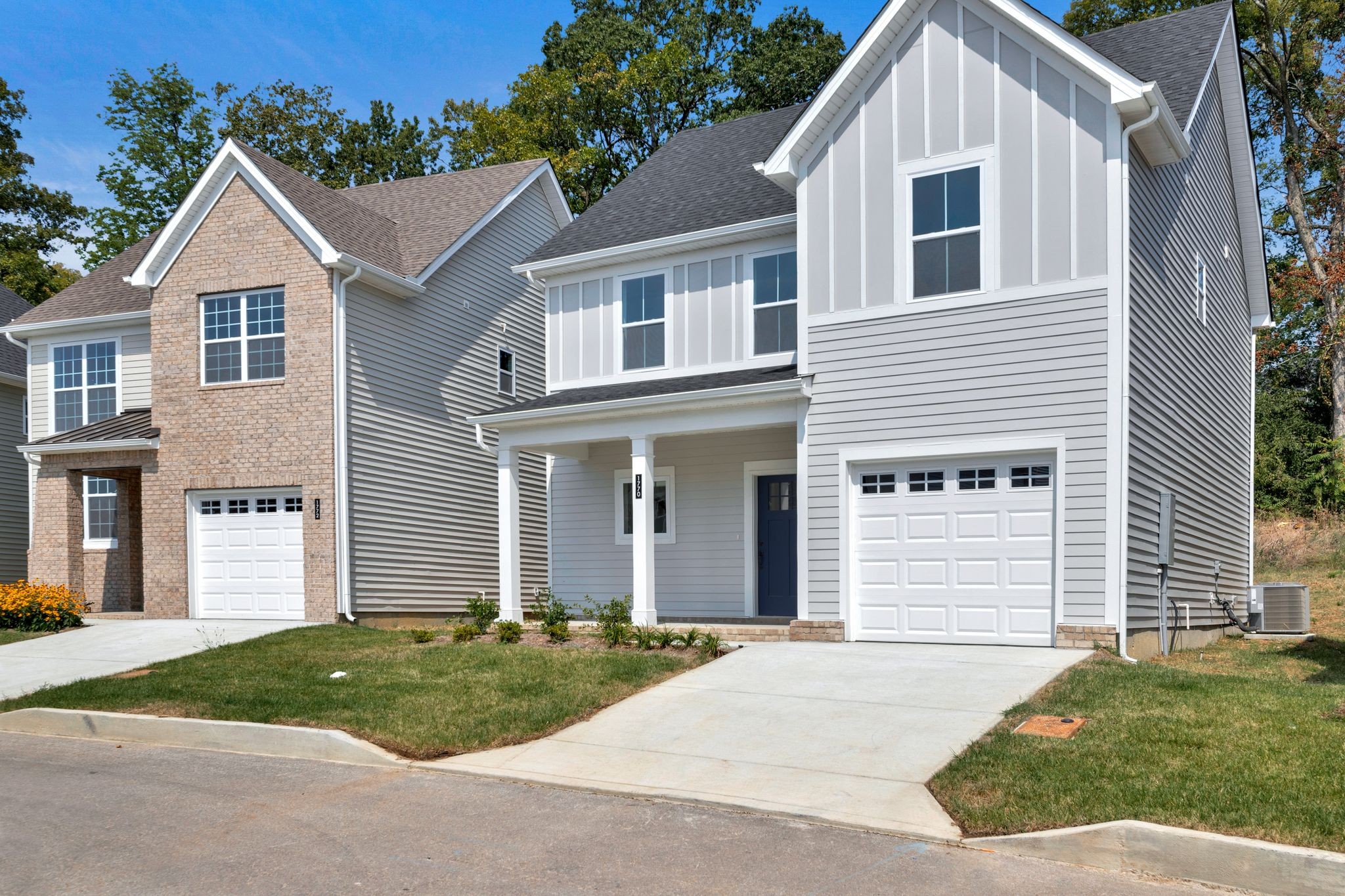 1770 Fenway Loop Antioch, TN 37013 - Photo 4 of 32 a front view of a house with a garden