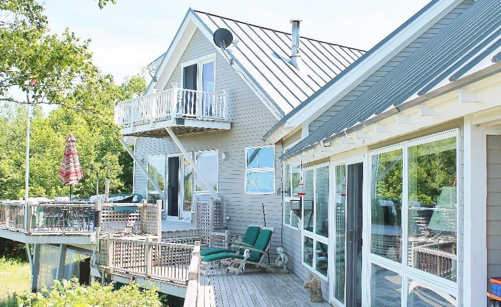 78 Bayridge Road Northport, ME 04849 - Photo 3 of 30 The deck steps up to the first floor...