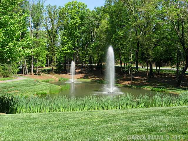 1312 Reflection Pointe Boulevard, Unit 331 Belmont, NC 28012 - Photo 3 of 11 a view of a garden with trees