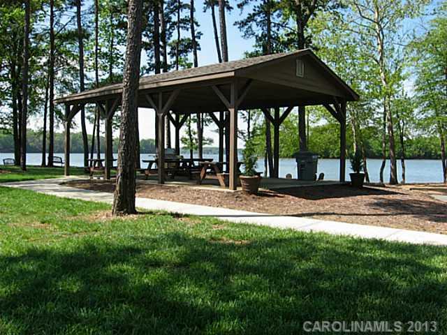 1312 Reflection Pointe Boulevard, Unit 331 Belmont, NC 28012 - Photo 5 of 11 a view of a park with a bench and trees