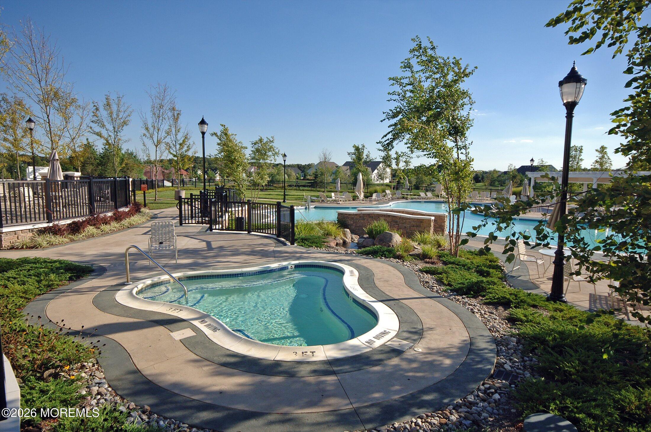 38 Park Ridge Way Jackson, NJ 08527 - Photo 13 of 22 a view of a swimming pool with outdoor seating