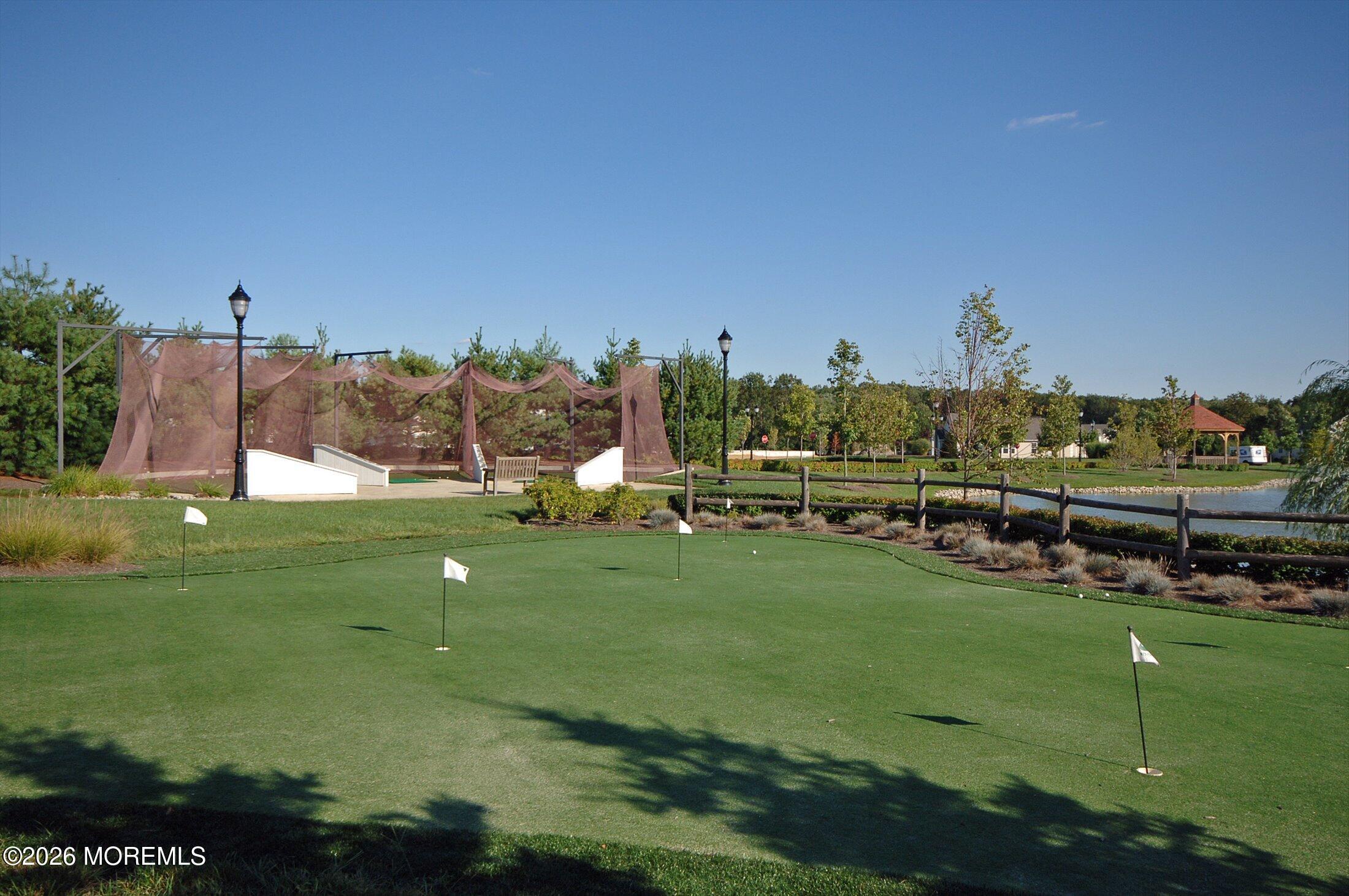 38 Park Ridge Way Jackson, NJ 08527 - Photo 14 of 22 a view of a golf course with a lake