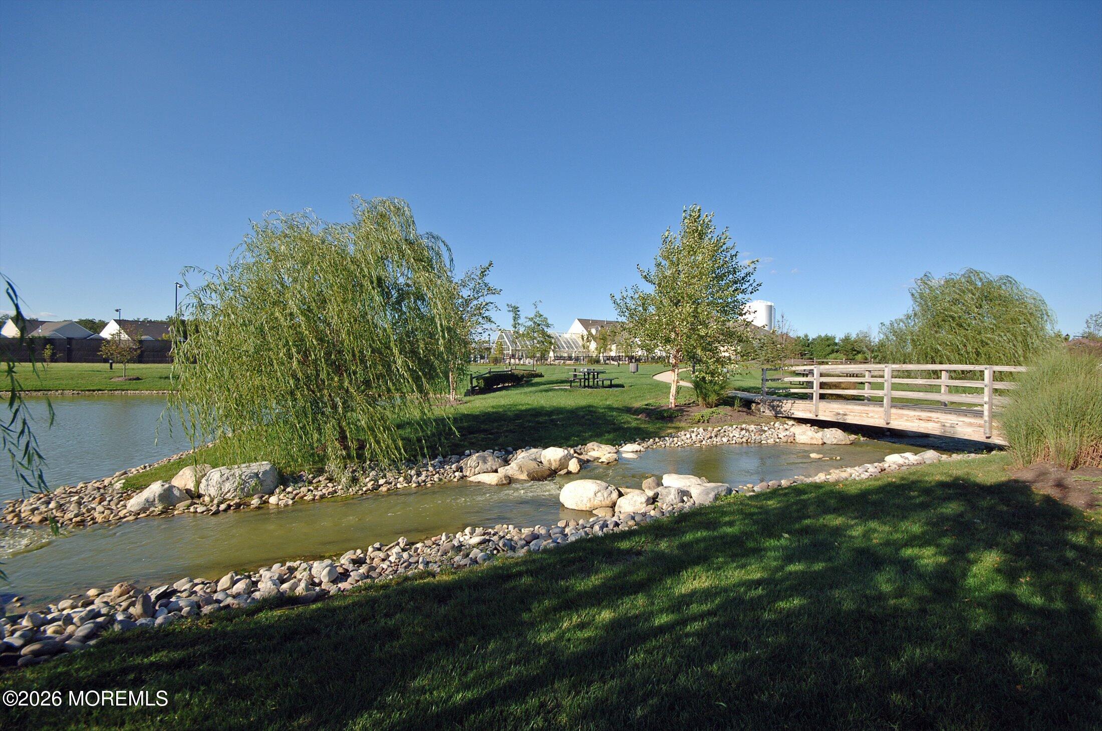 38 Park Ridge Way Jackson, NJ 08527 - Photo 16 of 22 a view of a lake with a city