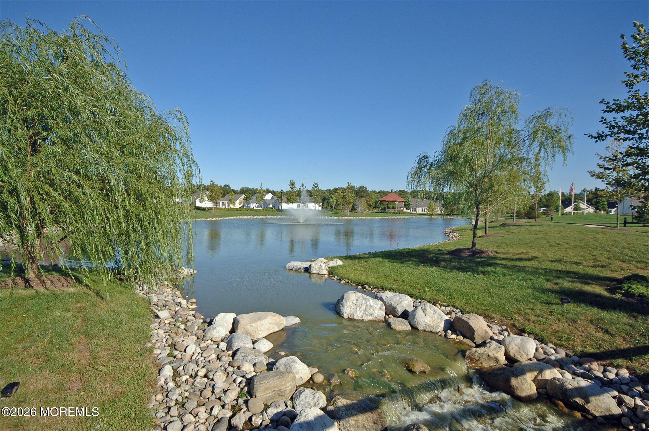 38 Park Ridge Way Jackson, NJ 08527 - Photo 19 of 22 a view of a lake with a house in the background