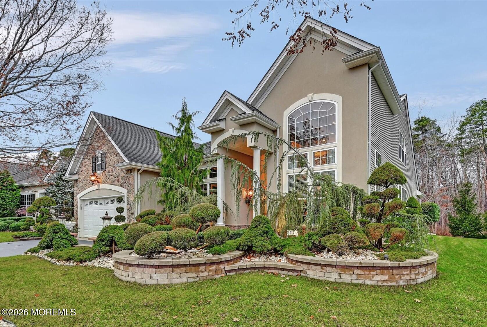 38 Park Ridge Way Jackson, NJ 08527 - Photo 2 of 22 a front view of a house with a yard