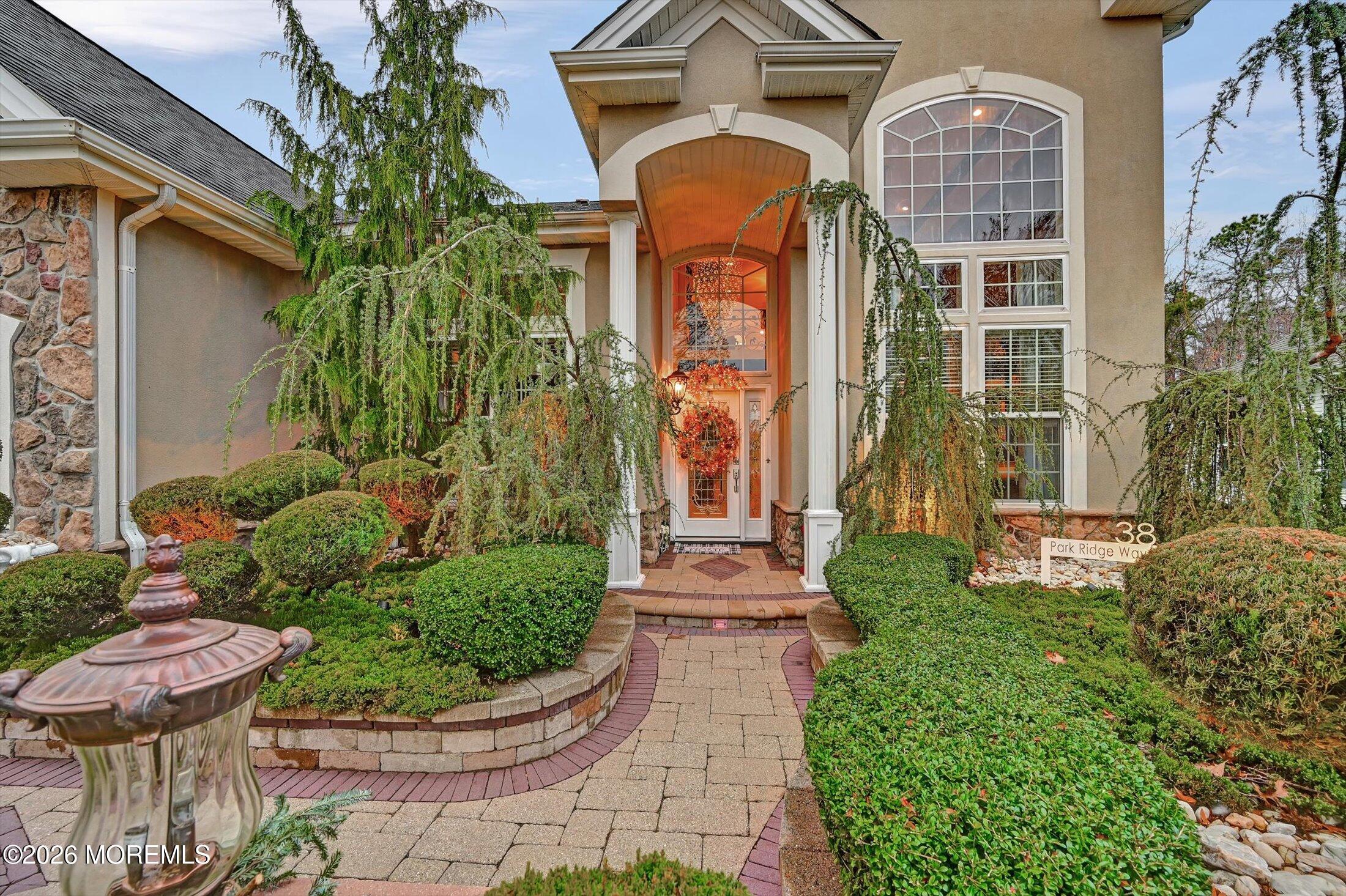38 Park Ridge Way Jackson, NJ 08527 - Photo 3 of 22 a front view of a house with a garden