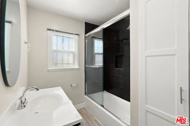 a bathroom with a bathtub and a sink