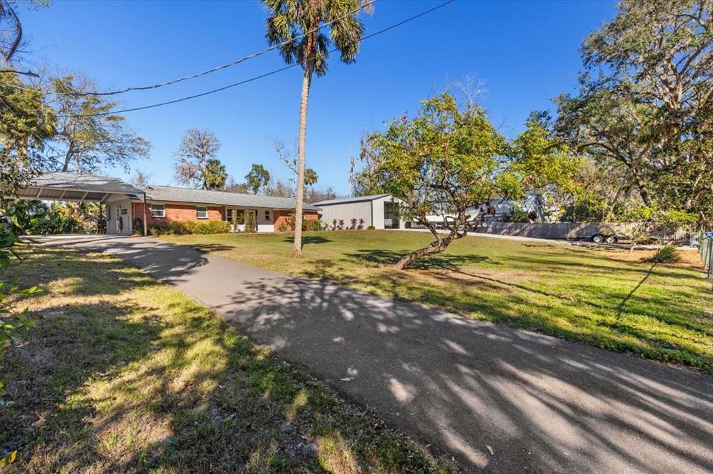7226 Alafia Ridge Loop Riverview, FL 33569 - Photo 50 of 51 a view of a yard with a house