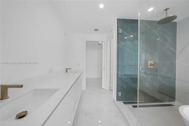 a bathroom with a bathtub and a sink