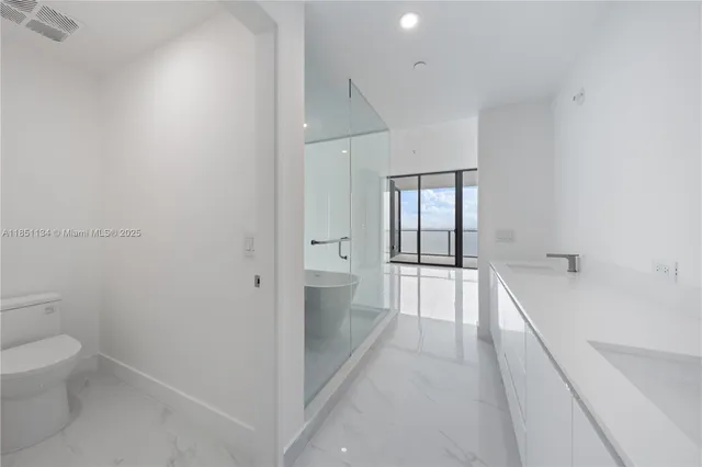 a bathroom with a sink and a large mirror