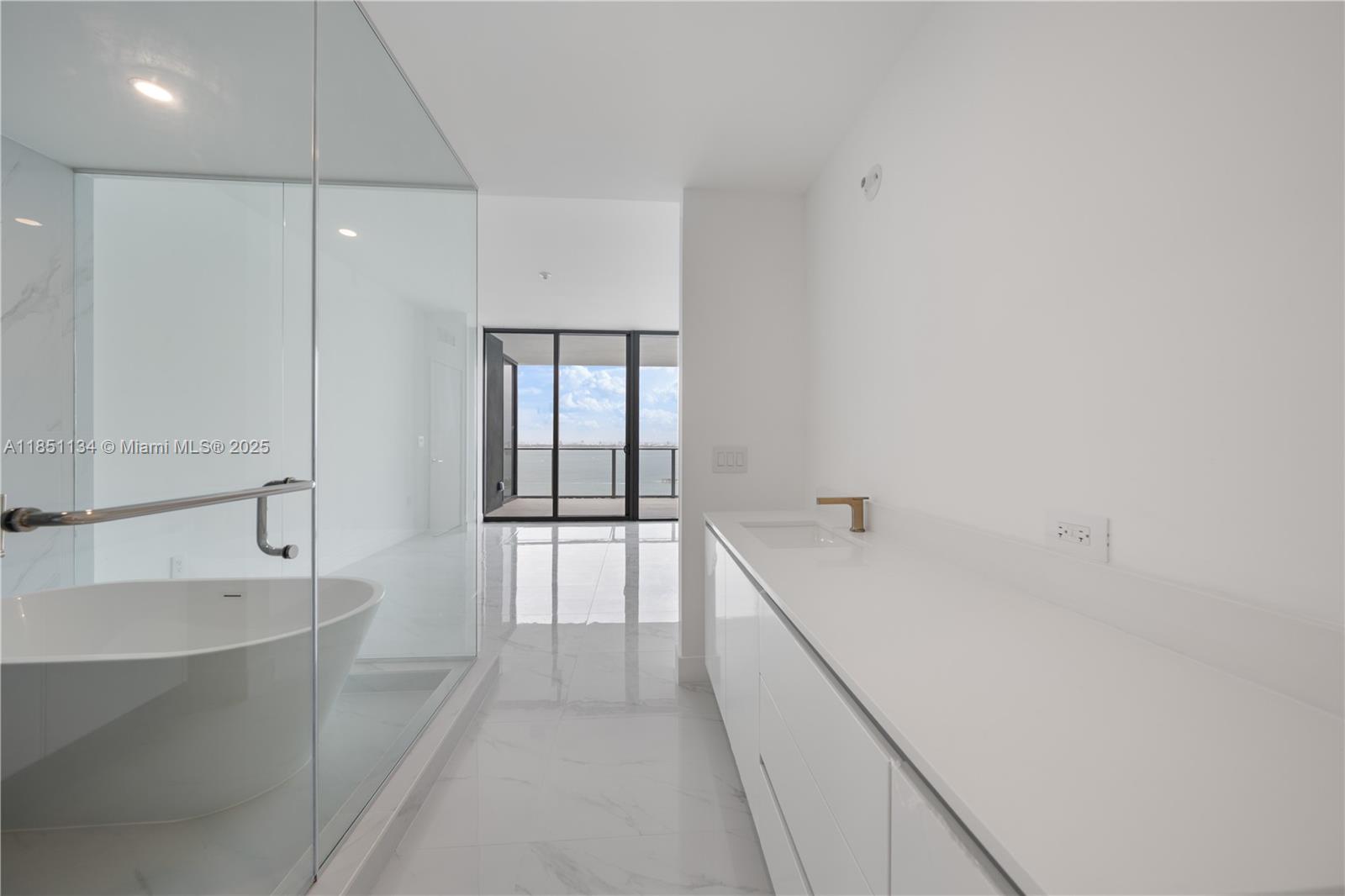 700 Northeast 24th Street, Unit 2503 Miami, FL 33137 - Photo 18 of 61 a bathroom with a bathtub and a sink