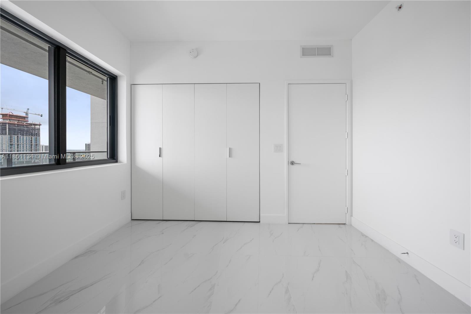 700 Northeast 24th Street, Unit 2503 Miami, FL 33137 - Photo 23 of 61 a view of an empty room with a window