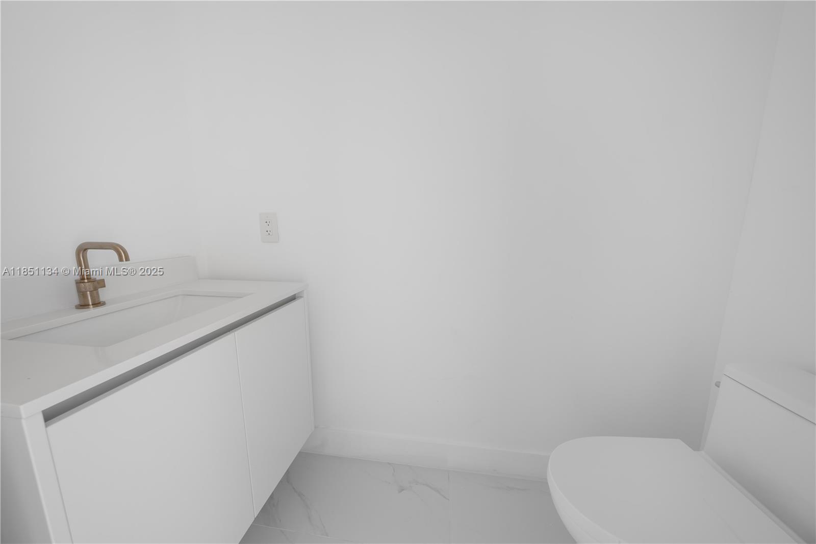 700 Northeast 24th Street, Unit 2503 Miami, FL 33137 - Photo 25 of 61 a bathroom with a toilet and sink