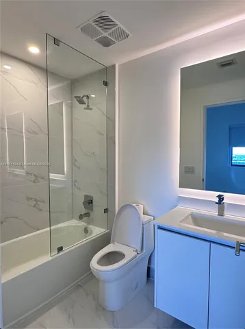 a view of an empty room and a window