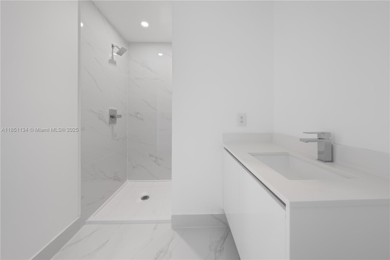 700 Northeast 24th Street, Unit 2503 Miami, FL 33137 - Photo 35 of 61 a bathroom with a sink a toilet and shower