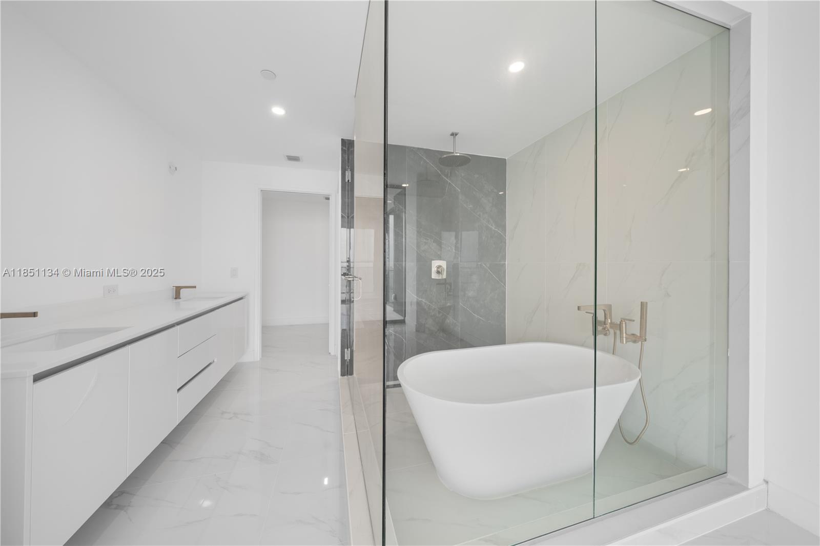 700 Northeast 24th Street, Unit 2503 Miami, FL 33137 - Photo 42 of 61 a bathroom with a bathtub and a shower