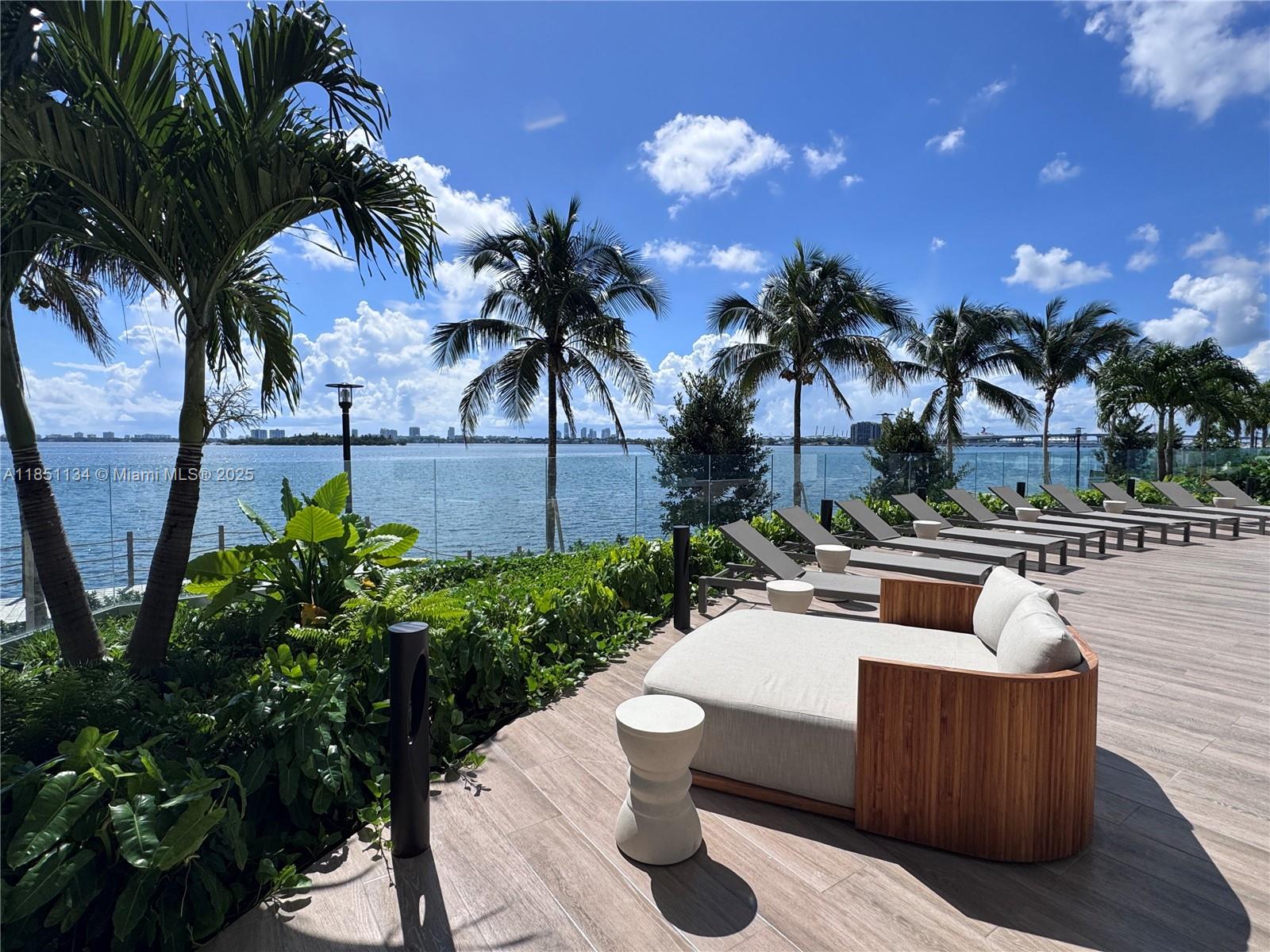 700 Northeast 24th Street, Unit 2503 Miami, FL 33137 - Photo 47 of 61 a view of a patio with couches and a fire pit