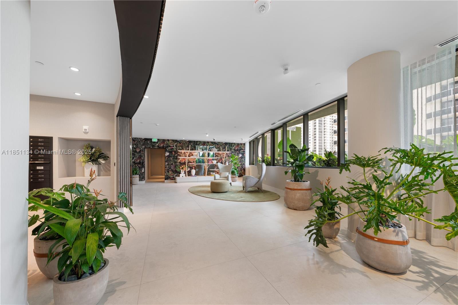 700 Northeast 24th Street, Unit 2503 Miami, FL 33137 - Photo 54 of 61 a lobby with furniture and potted plants