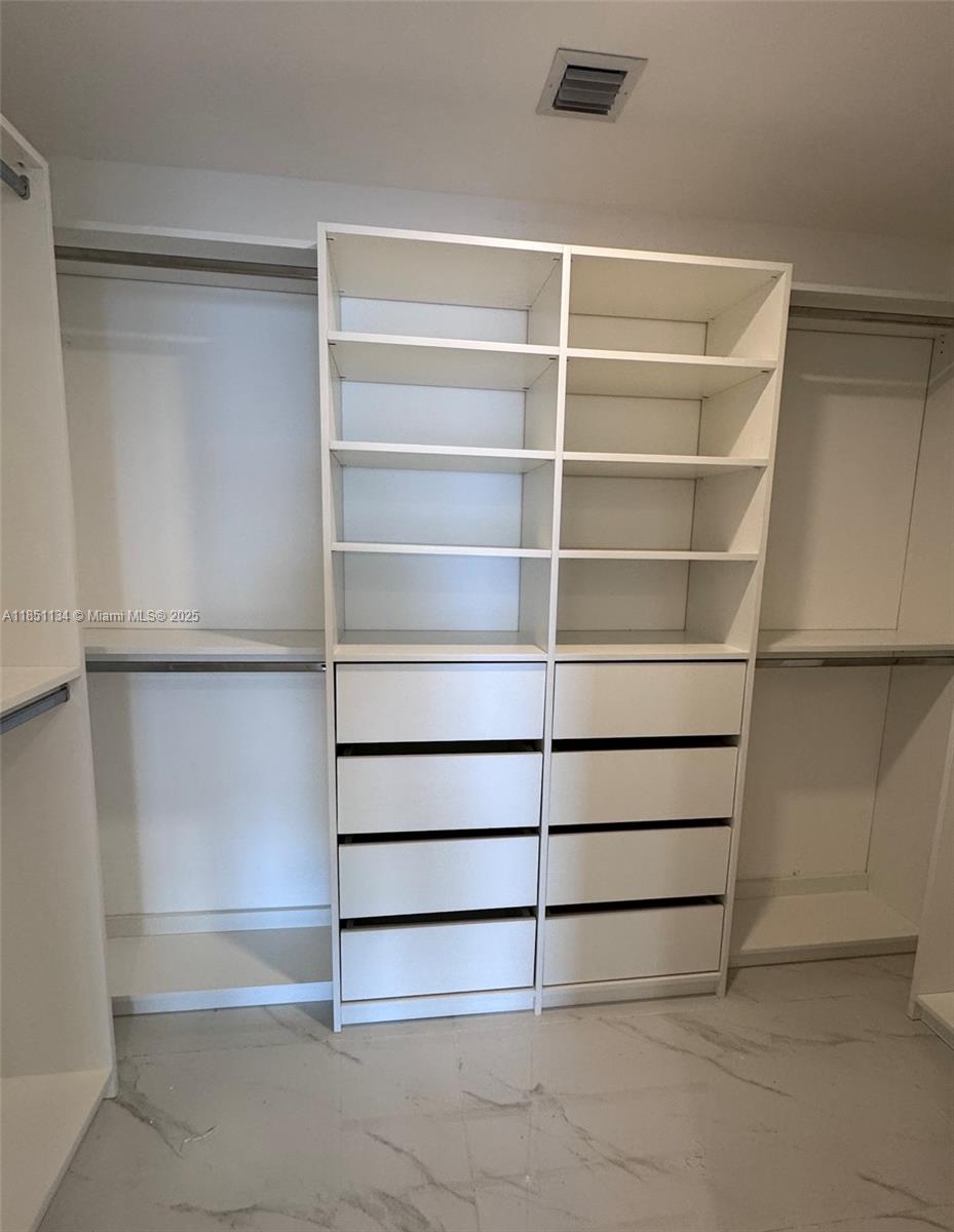 700 Northeast 24th Street, Unit 2503 Miami, FL 33137 - Photo 61 of 61 a view of walk in closet with empty racks