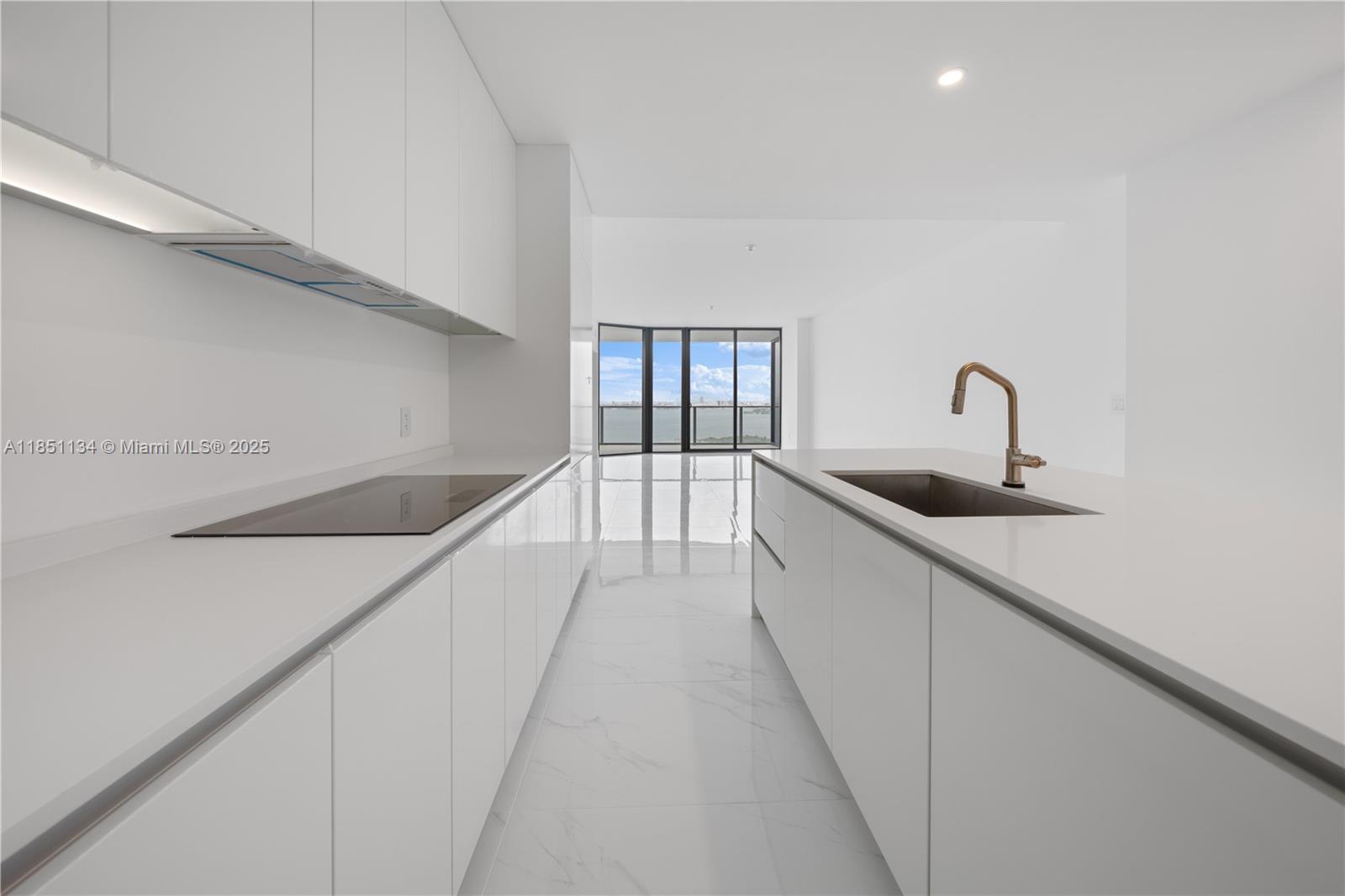 700 Northeast 24th Street, Unit 2503 Miami, FL 33137 - Photo 8 of 61 a hallway with a sink and chandelier