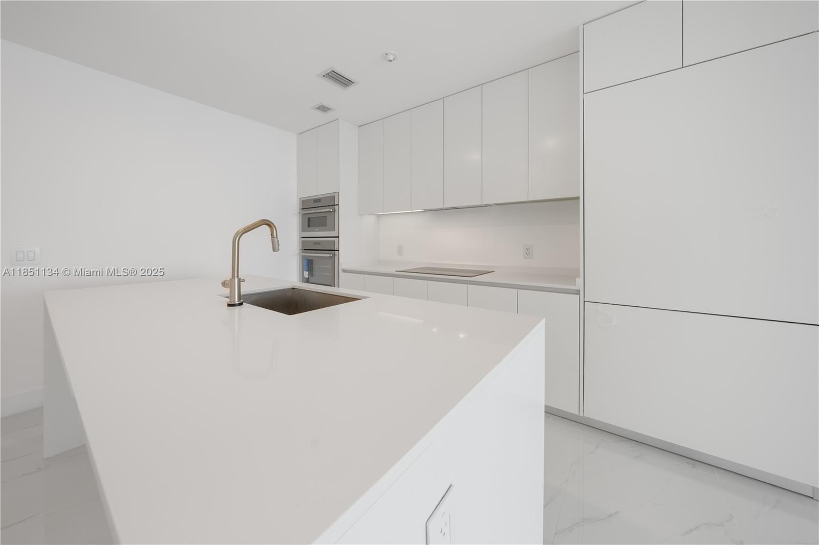 700 Northeast 24th Street, Unit 2503 Miami, FL 33137 - Photo 10 of 61 a close view of a faucet in the kitchen