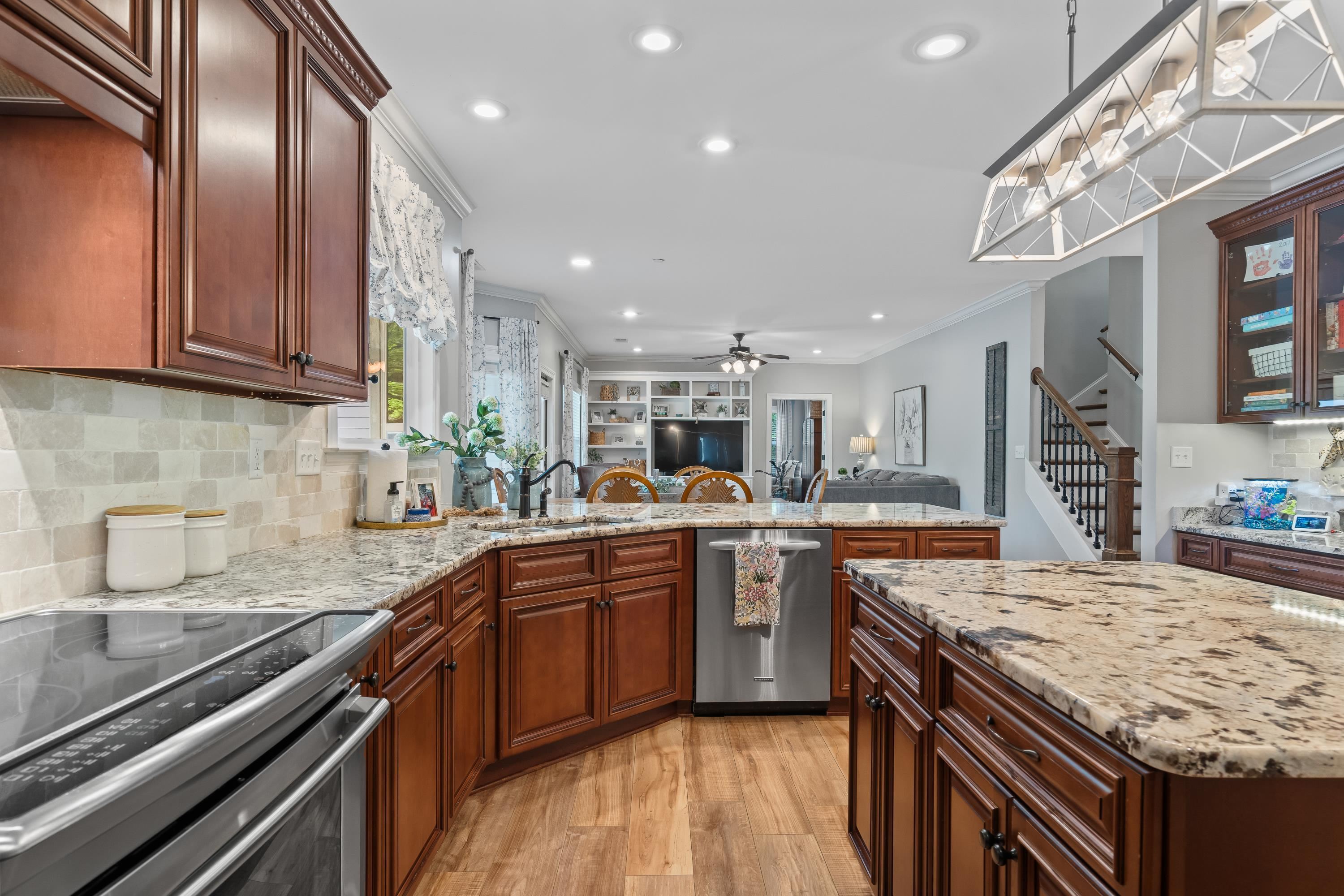 210 Poplar Acres Road Piperton, TN 38017 - Photo 11 of 40 a kitchen with stainless steel appliances granite countertop a sink stove and cabinets