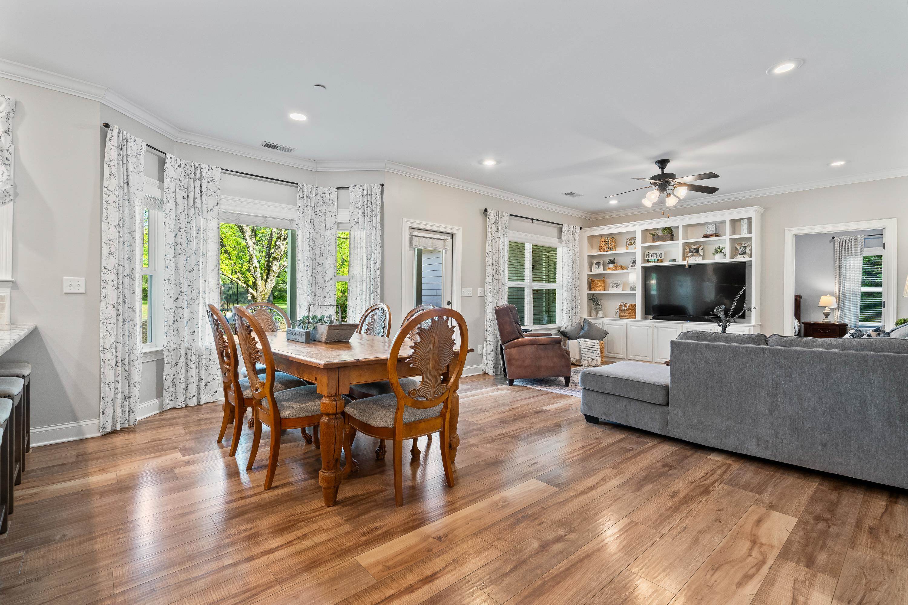 210 Poplar Acres Road Piperton, TN 38017 - Photo 13 of 40 a living room with furniture a wooden floor and a window