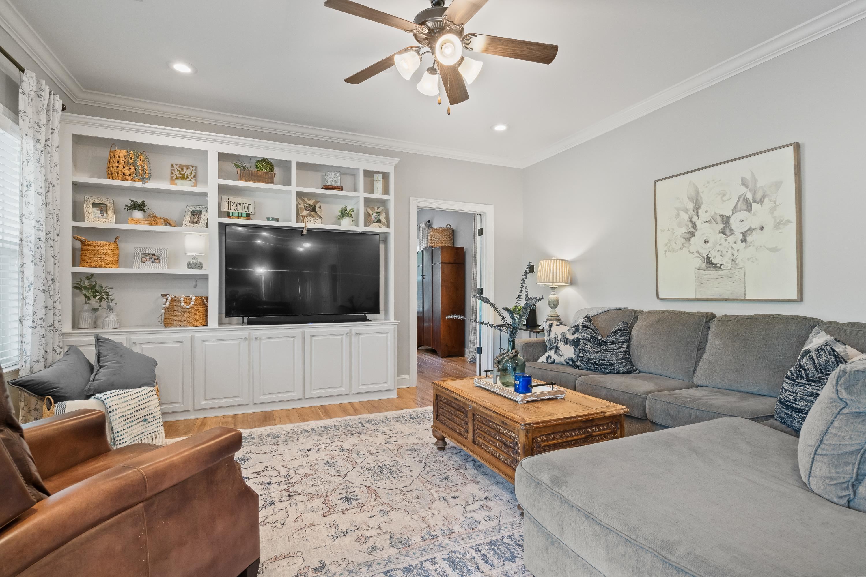 210 Poplar Acres Road Piperton, TN 38017 - Photo 14 of 40 a living room with furniture and a flat screen tv
