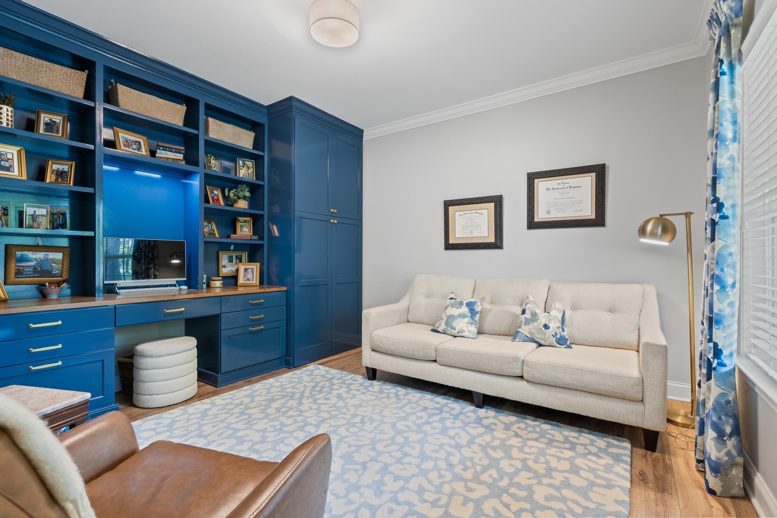 210 Poplar Acres Road Piperton, TN 38017 - Photo 22 of 40 a living room with furniture and a book shelf
