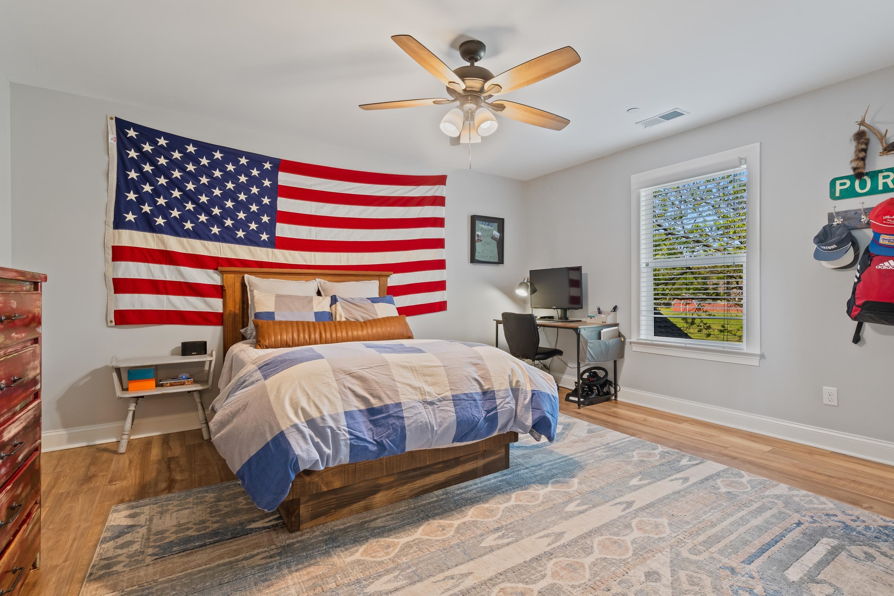 210 Poplar Acres Road Piperton, TN 38017 - Photo 26 of 40 a bedroom with a bed and a chandelier