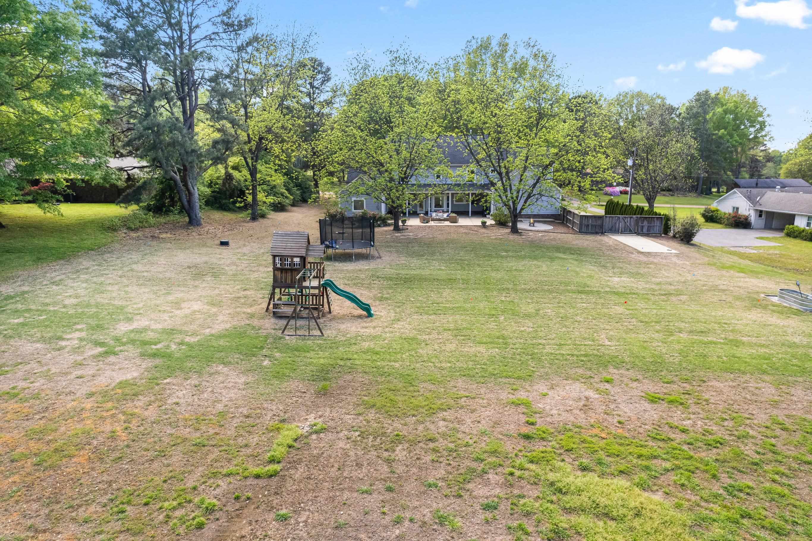 210 Poplar Acres Road Piperton, TN 38017 - Photo 37 of 40 a view of a park with swings and slides