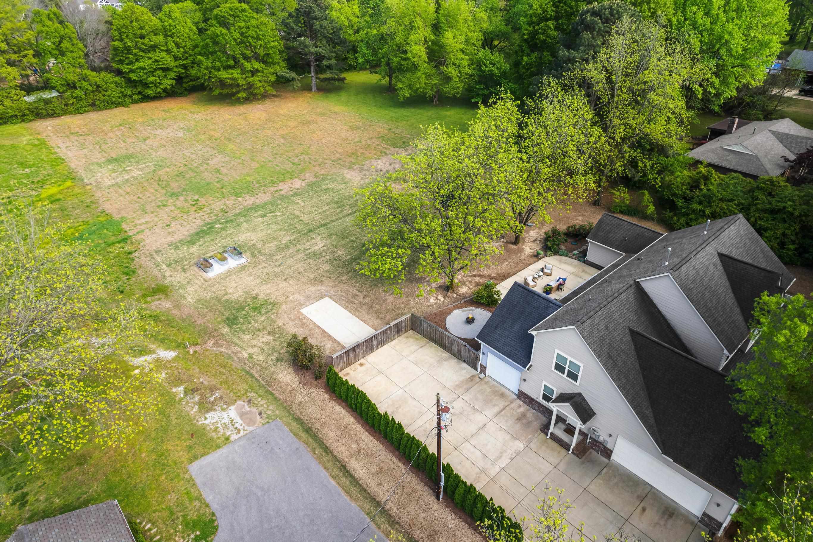 210 Poplar Acres Road Piperton, TN 38017 - Photo 39 of 40 an aerial view of a house with a yard basket ball court and outdoor seating
