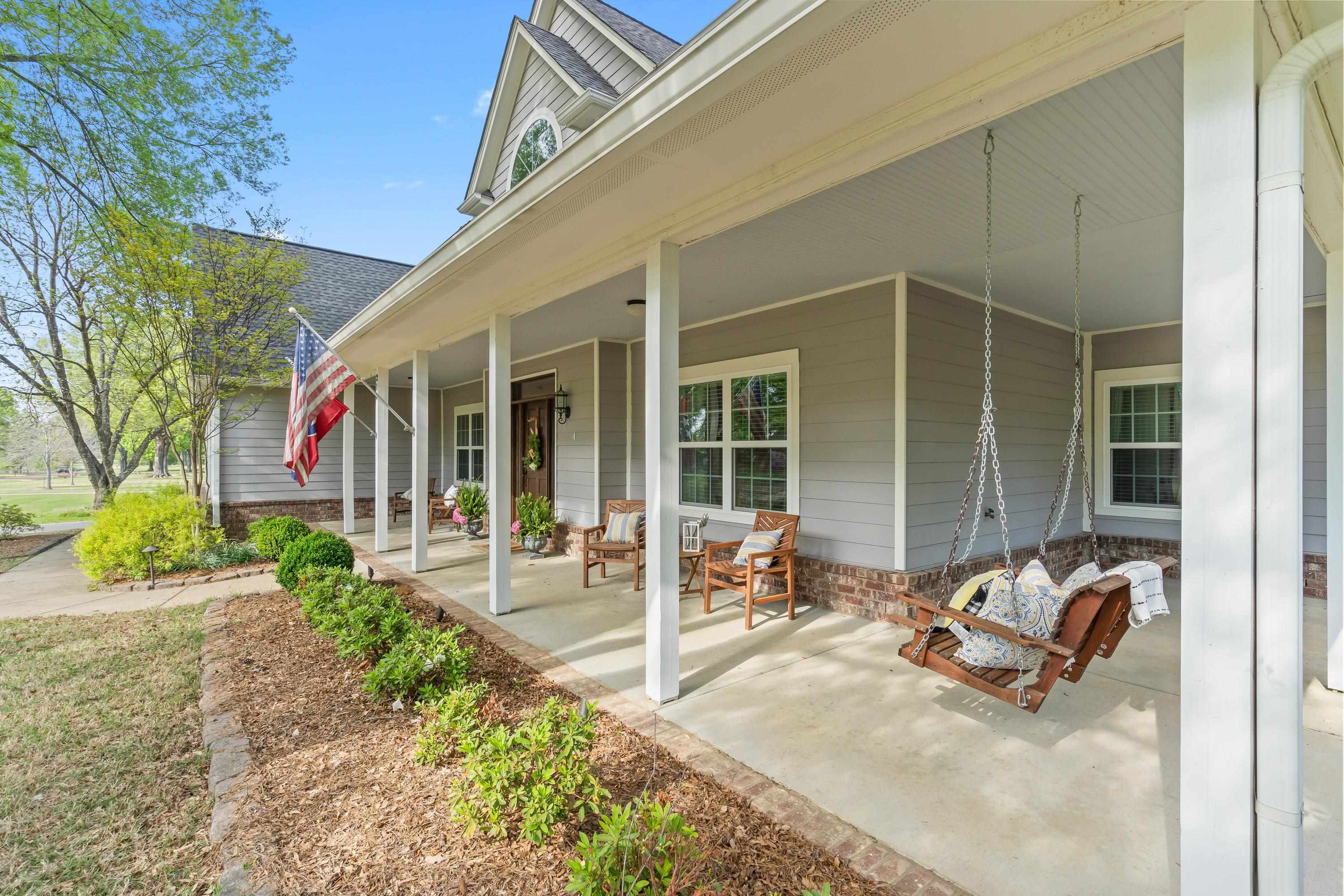 210 Poplar Acres Road Piperton, TN 38017 - Photo 6 of 40 a view of a patio with table and chairs and wooden fence