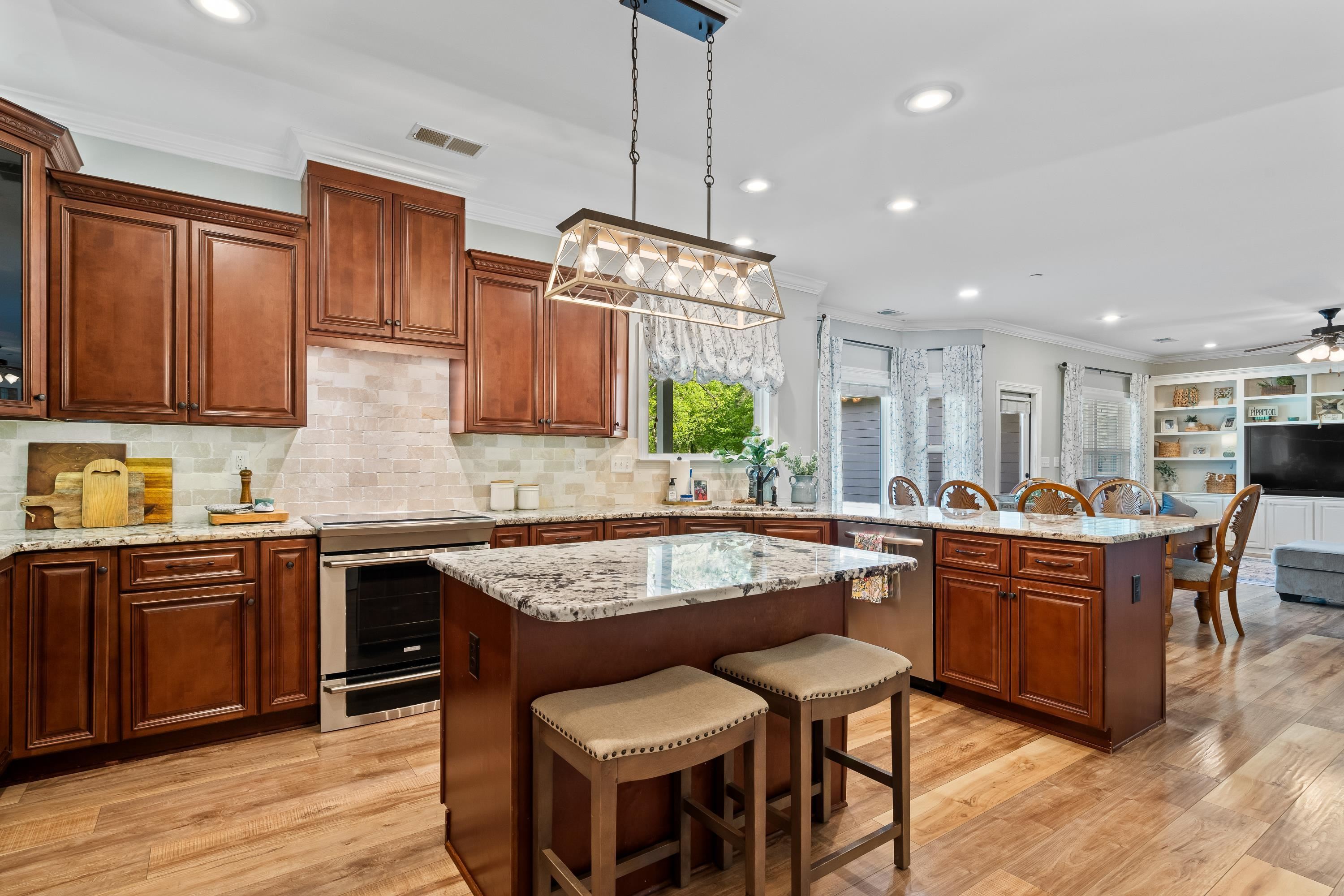 210 Poplar Acres Road Piperton, TN 38017 - Photo 10 of 40 a kitchen with granite countertop lots of counter top space and dining table