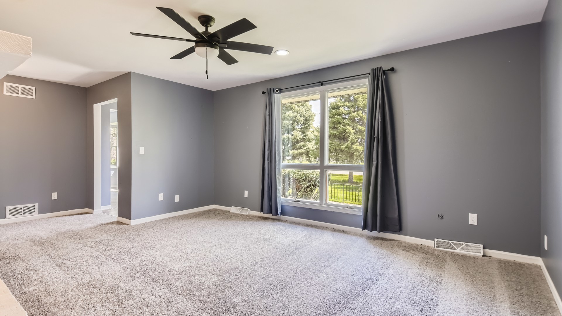 16156 Weber Road Crest Hill, IL 60403 - Photo 17 of 39 a view of a livingroom with a ceiling fan and window