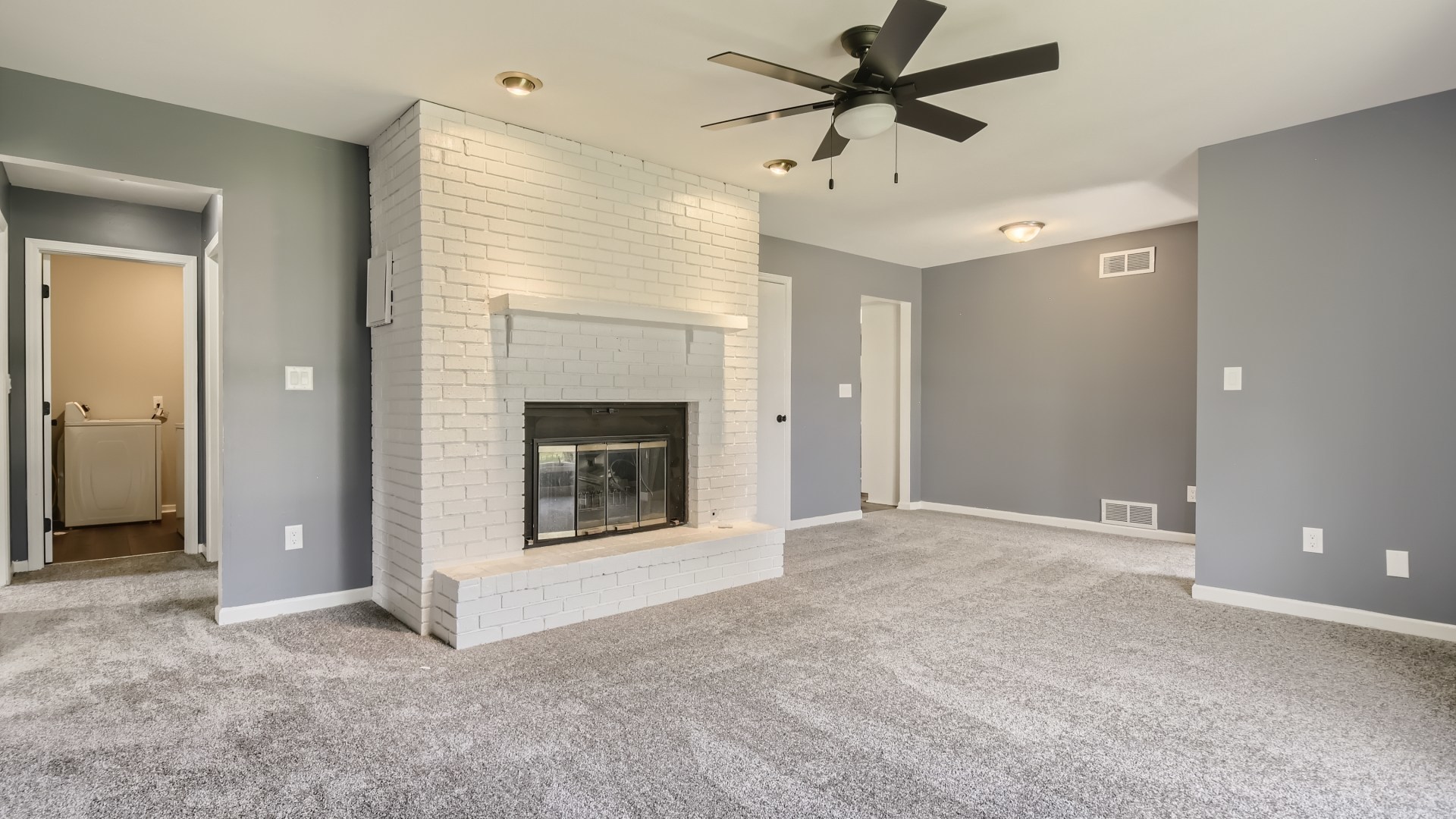 16156 Weber Road Crest Hill, IL 60403 - Photo 18 of 39 a view of a livingroom with a fireplace and a ceiling fan