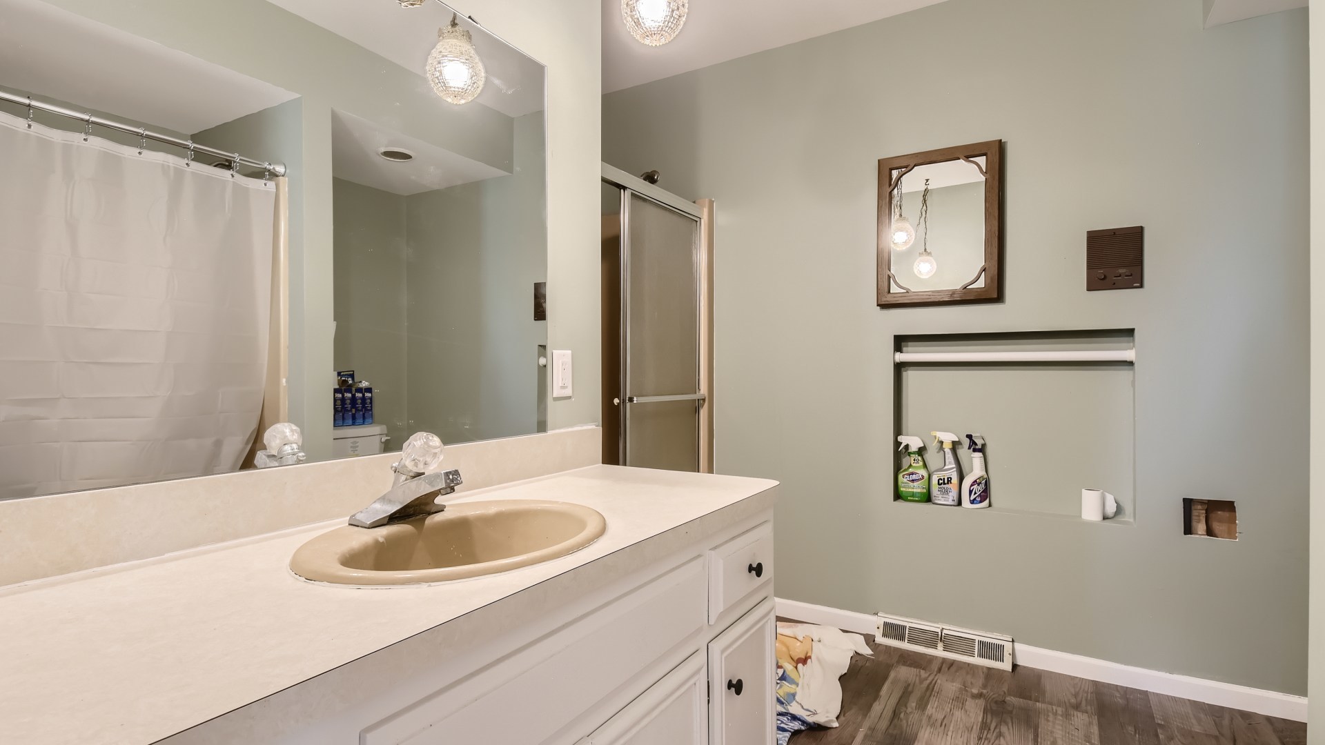 16156 Weber Road Crest Hill, IL 60403 - Photo 23 of 39 a bathroom with a sink and a mirror