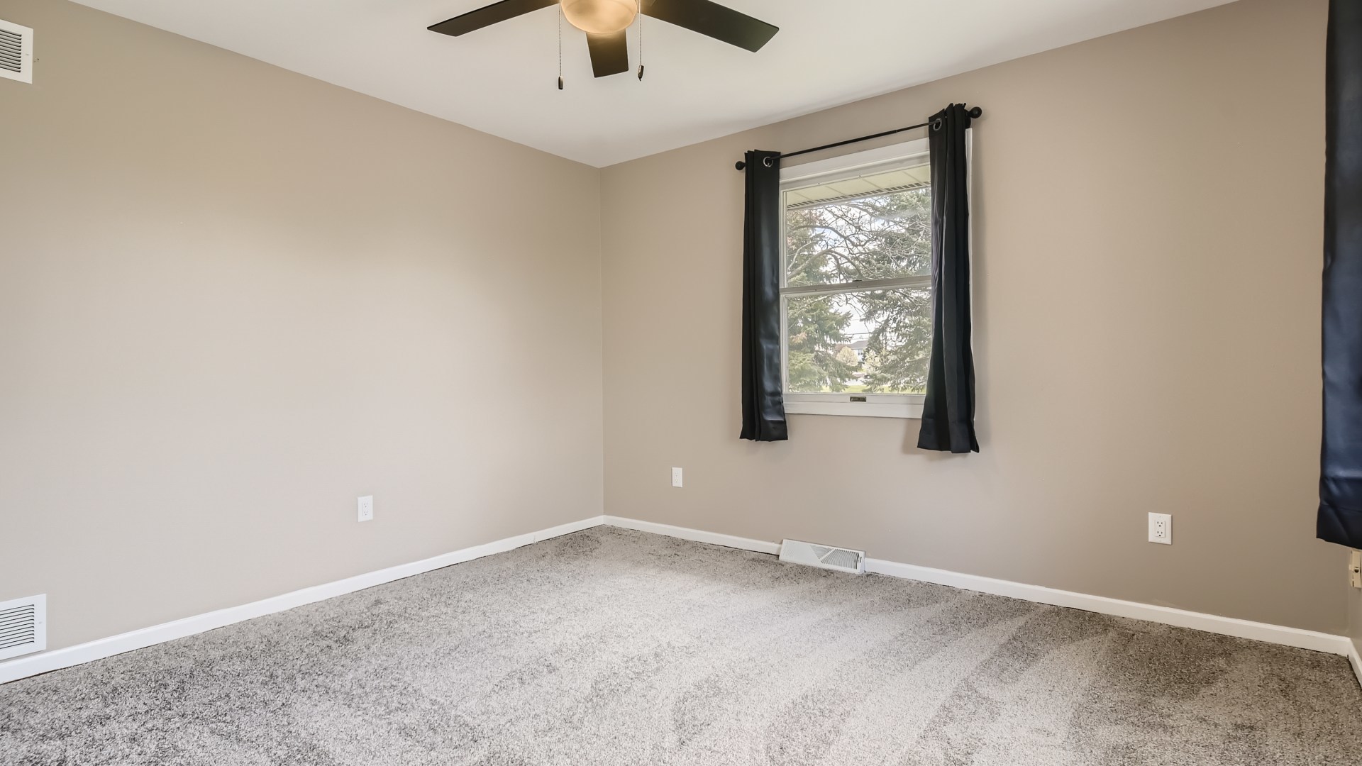 16156 Weber Road Crest Hill, IL 60403 - Photo 24 of 39 an empty room with windows and fan