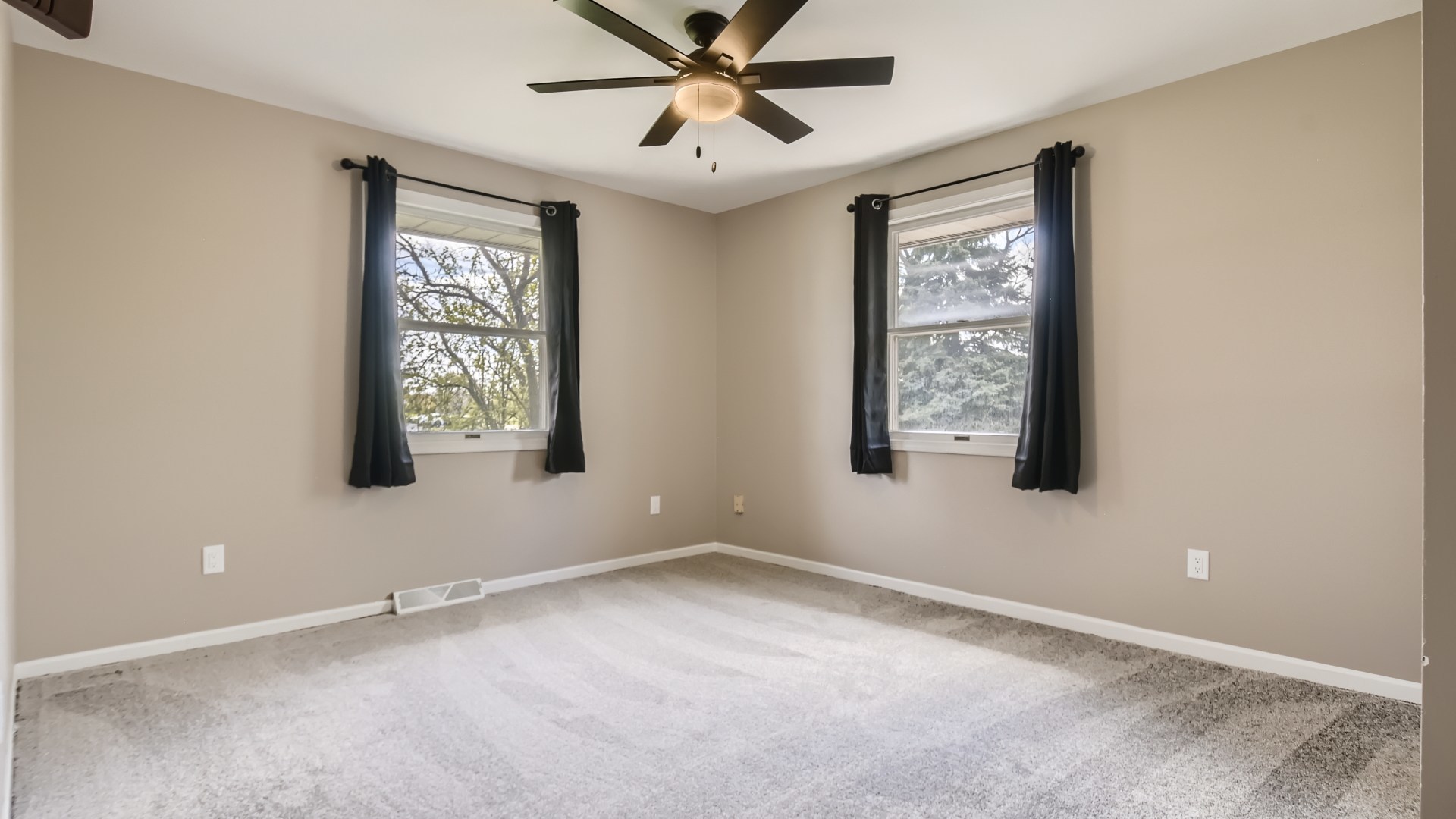 16156 Weber Road Crest Hill, IL 60403 - Photo 26 of 39 an empty room with windows and fan