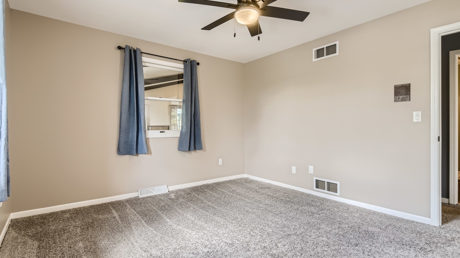 16156 Weber Road Crest Hill, IL 60403 - Photo 28 of 39 an empty room with a window and a ceiling fan