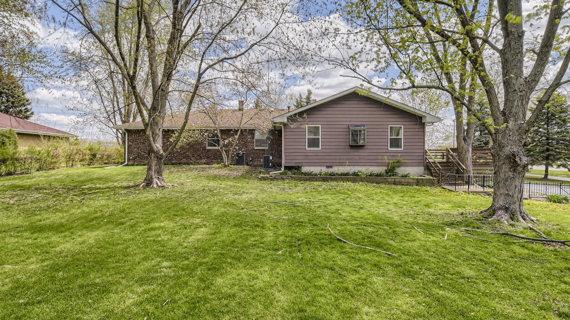 16156 Weber Road Crest Hill, IL 60403 - Photo 3 of 39 a house view with a garden and trees