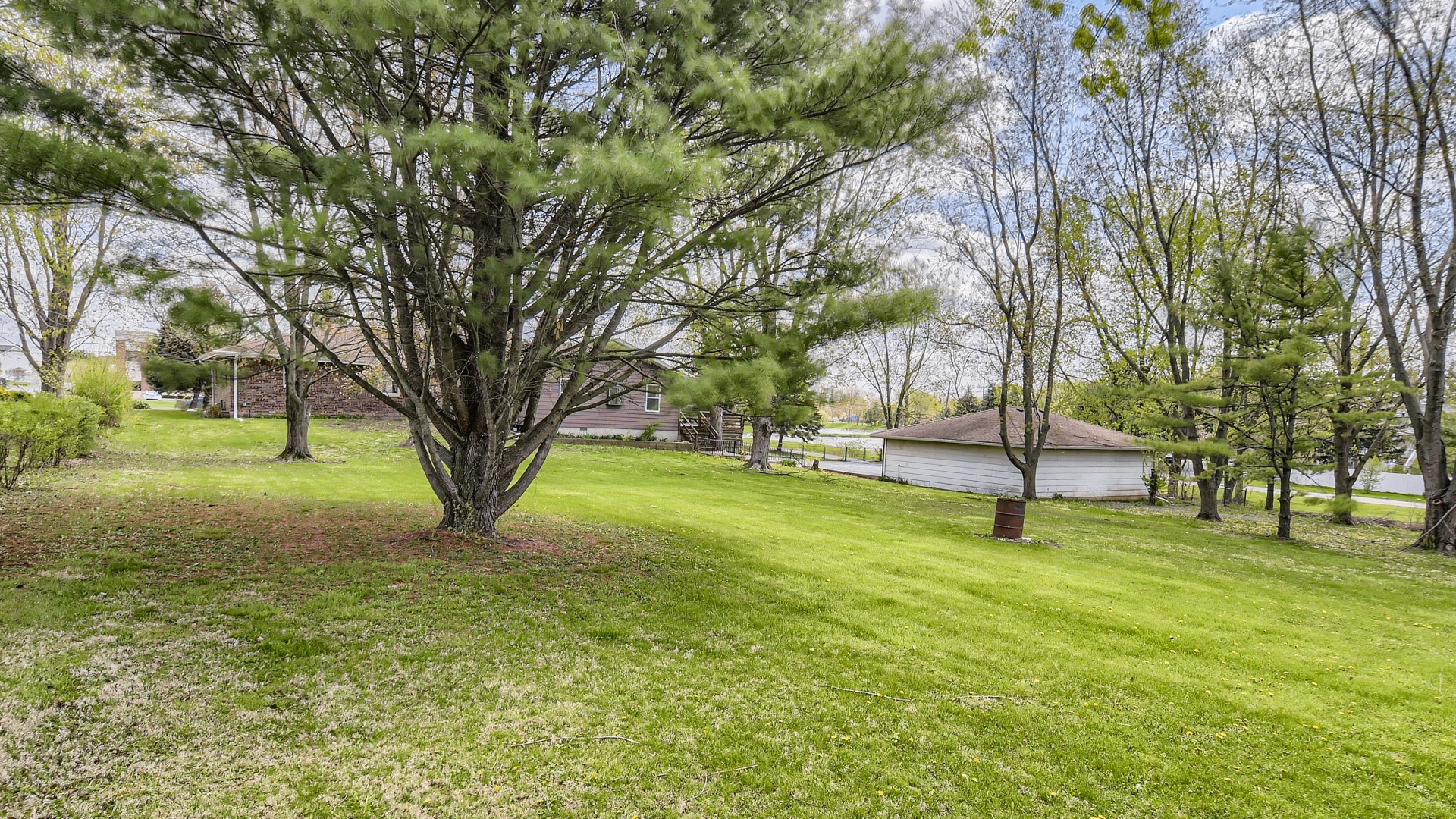 16156 Weber Road Crest Hill, IL 60403 - Photo 38 of 39 a view of a yard with a tree
