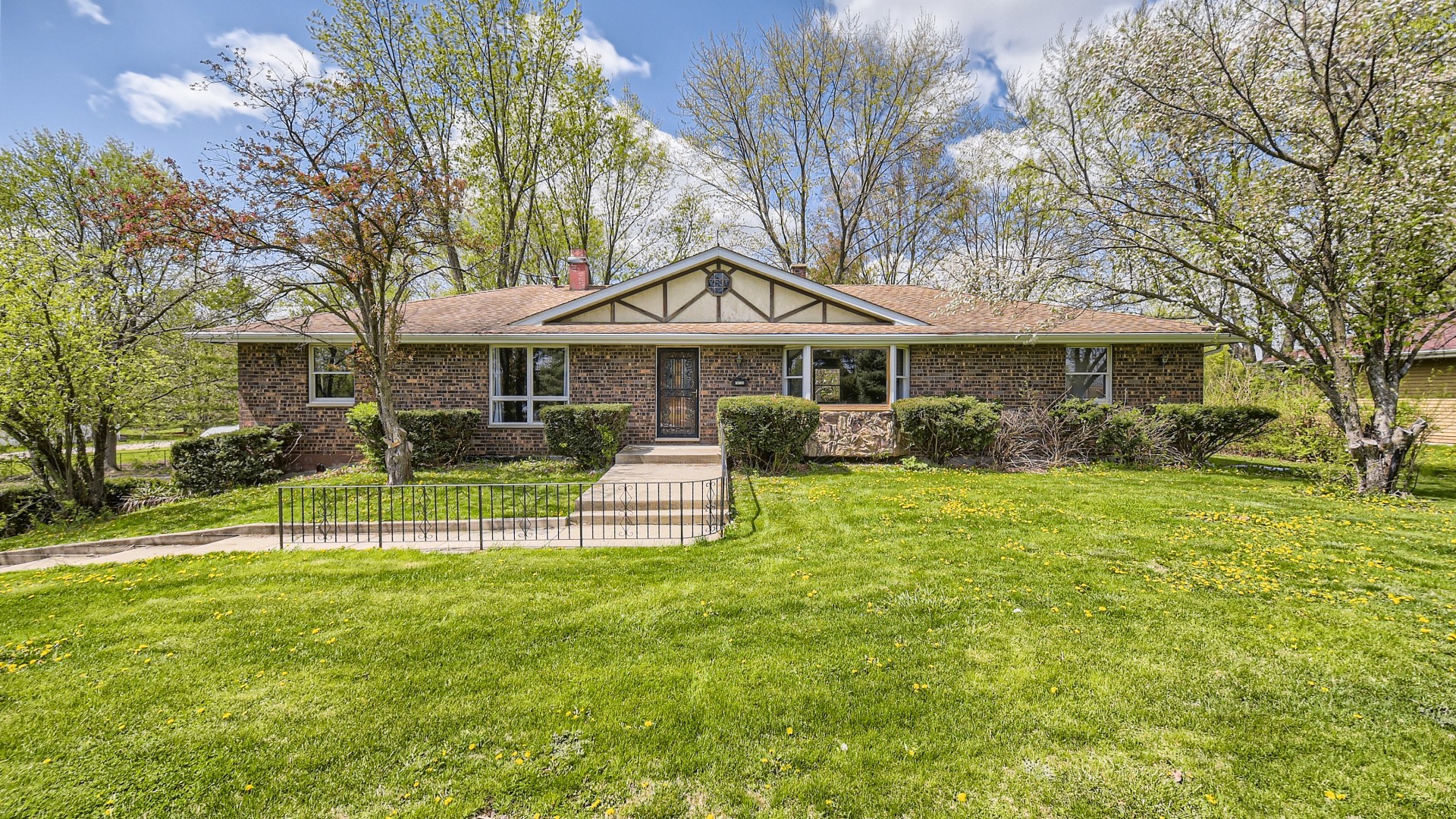 16156 Weber Road Crest Hill, IL 60403 - Photo 39 of 39 a front view of a house with a yard table and chairs