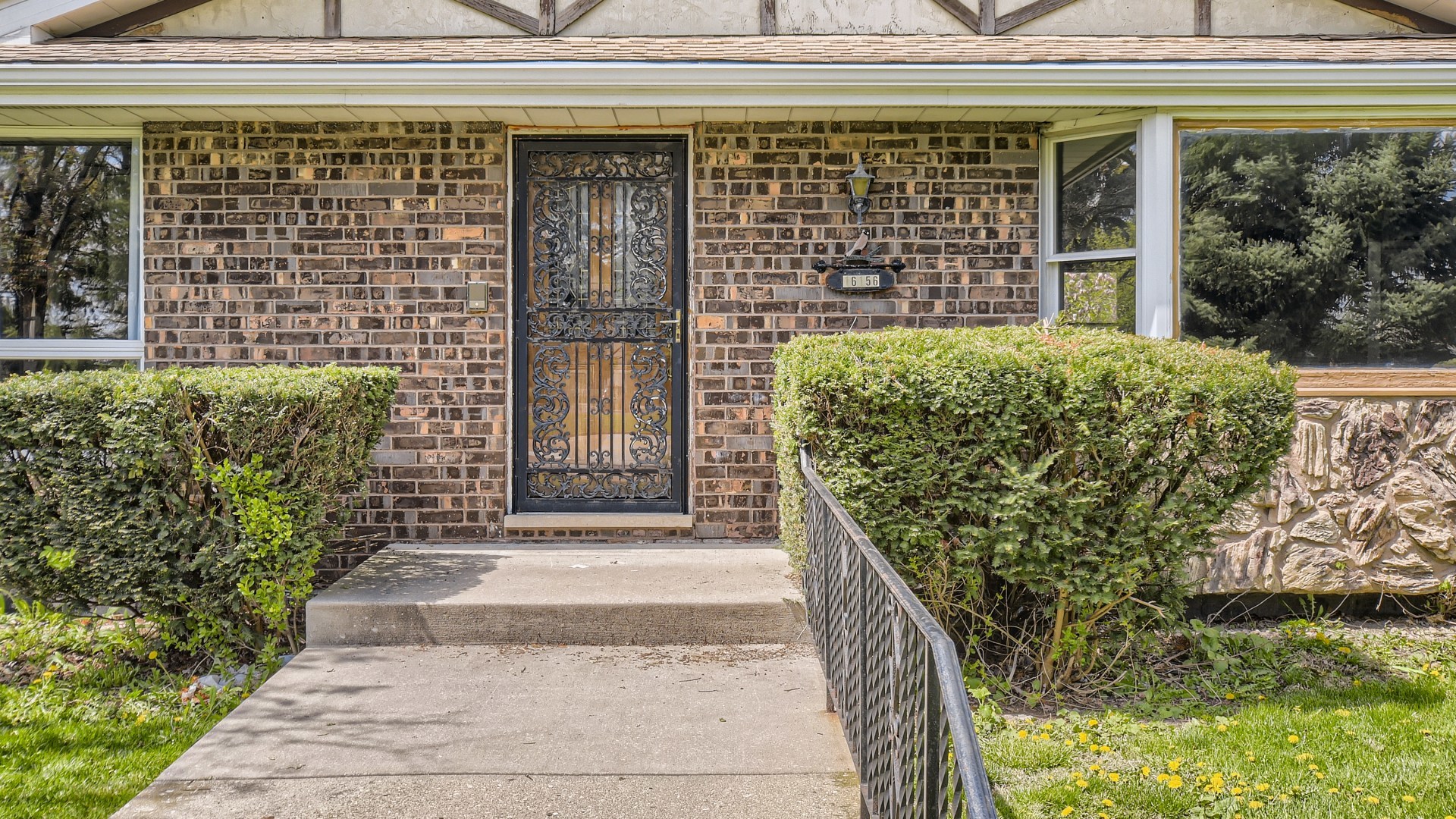 16156 Weber Road Crest Hill, IL 60403 - Photo 4 of 39 a front view of a house with a garden