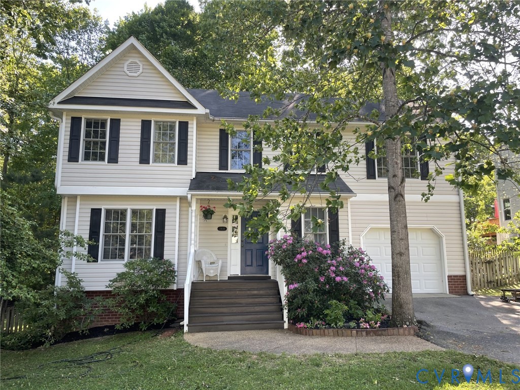 1918 Castle Glen Drive Chesterfield, VA 23236 - Photo 2 of 33 a front view of a house with a yard and trees