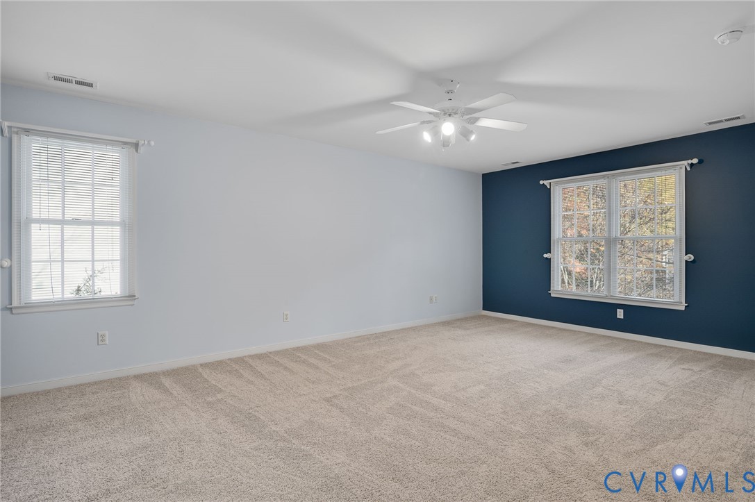 1918 Castle Glen Drive Chesterfield, VA 23236 - Photo 24 of 33 an empty room with windows and fan