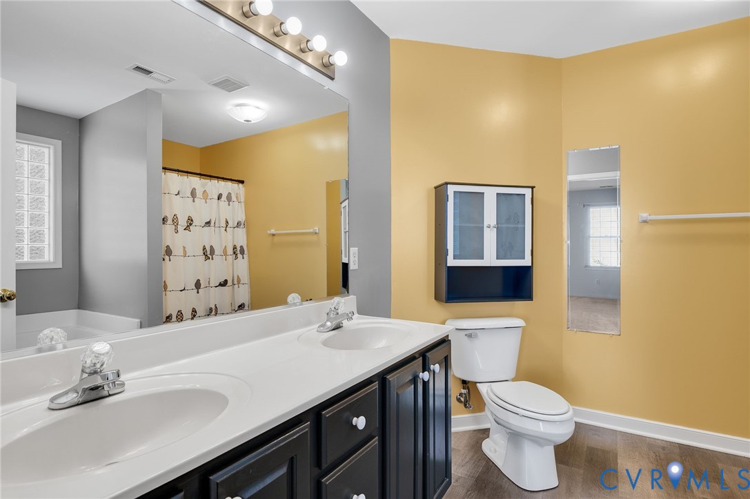 1918 Castle Glen Drive Chesterfield, VA 23236 - Photo 27 of 33 a bathroom with a sink a toilet and shower